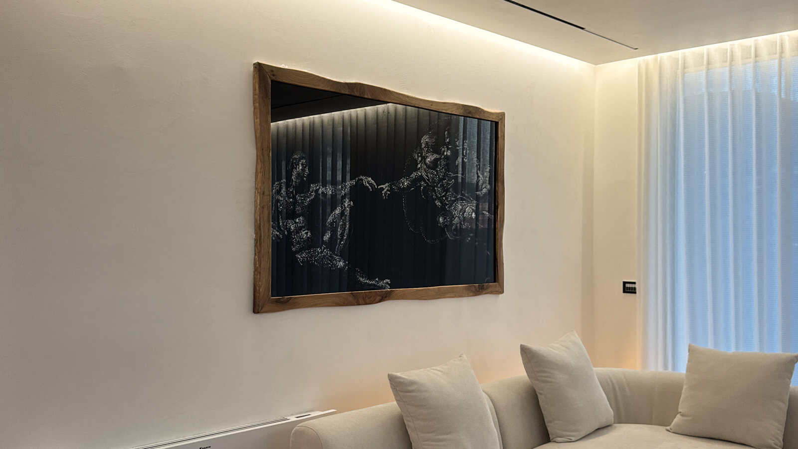 Commissioned glass fracture work installed above a sofa